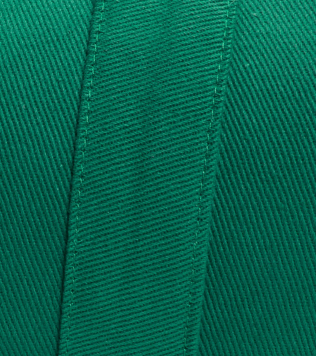 Everyday Yoga Kale Yoga Bolster in close-up, showcasing the detailed texture and stitching of the green fabric. This bolster is designed for yoga practice, providing support and comfort.