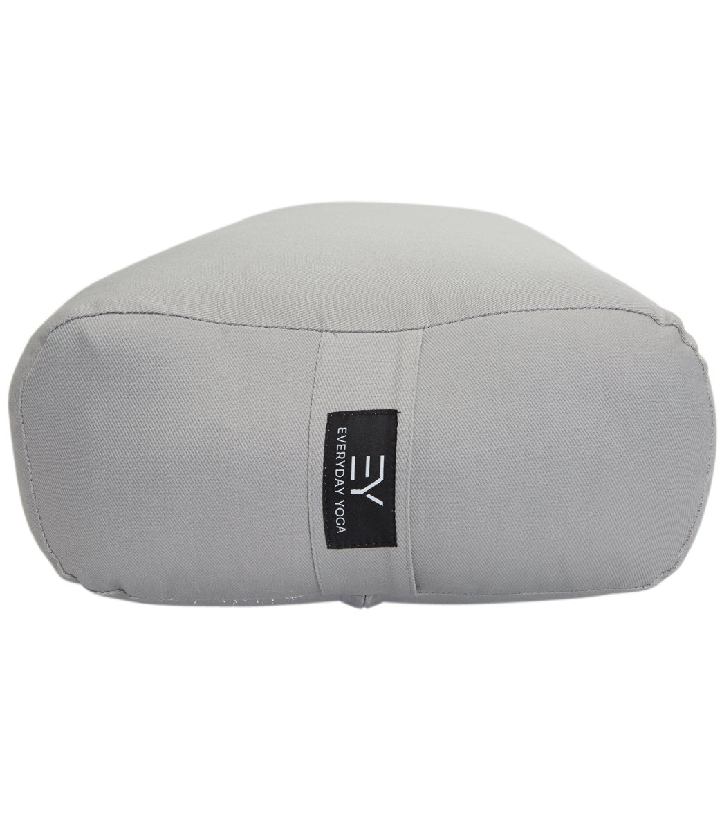 Everyday Yoga Slate Yoga Bolster, designed for yoga practice, provides support and comfort during poses. This grey bolster features durable fabric and a convenient carrying handle.
