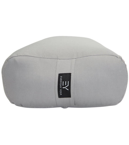 Everyday Yoga Slate Yoga Bolster, designed for yoga practice, provides support and comfort during poses. This grey bolster features durable fabric and a convenient carrying handle.