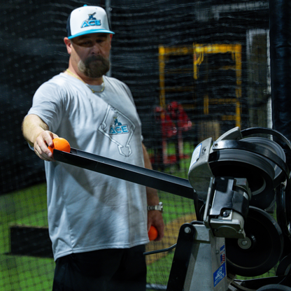 Extended baseball pitching machine chute source image 4